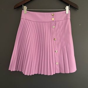Faux leather mini skirt with buttons